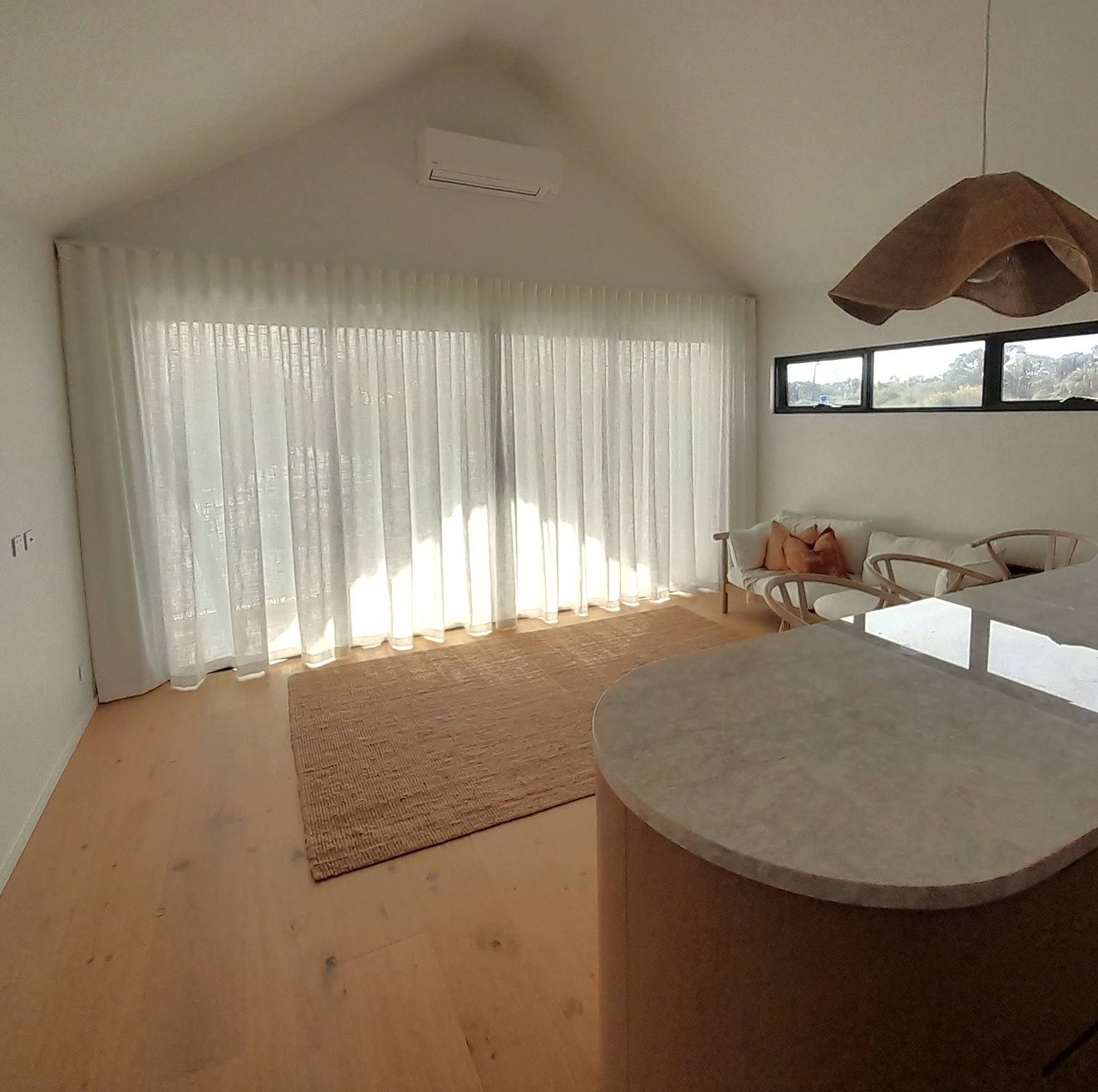 Abaca Chalk Bright minimalist living room with wooden floor